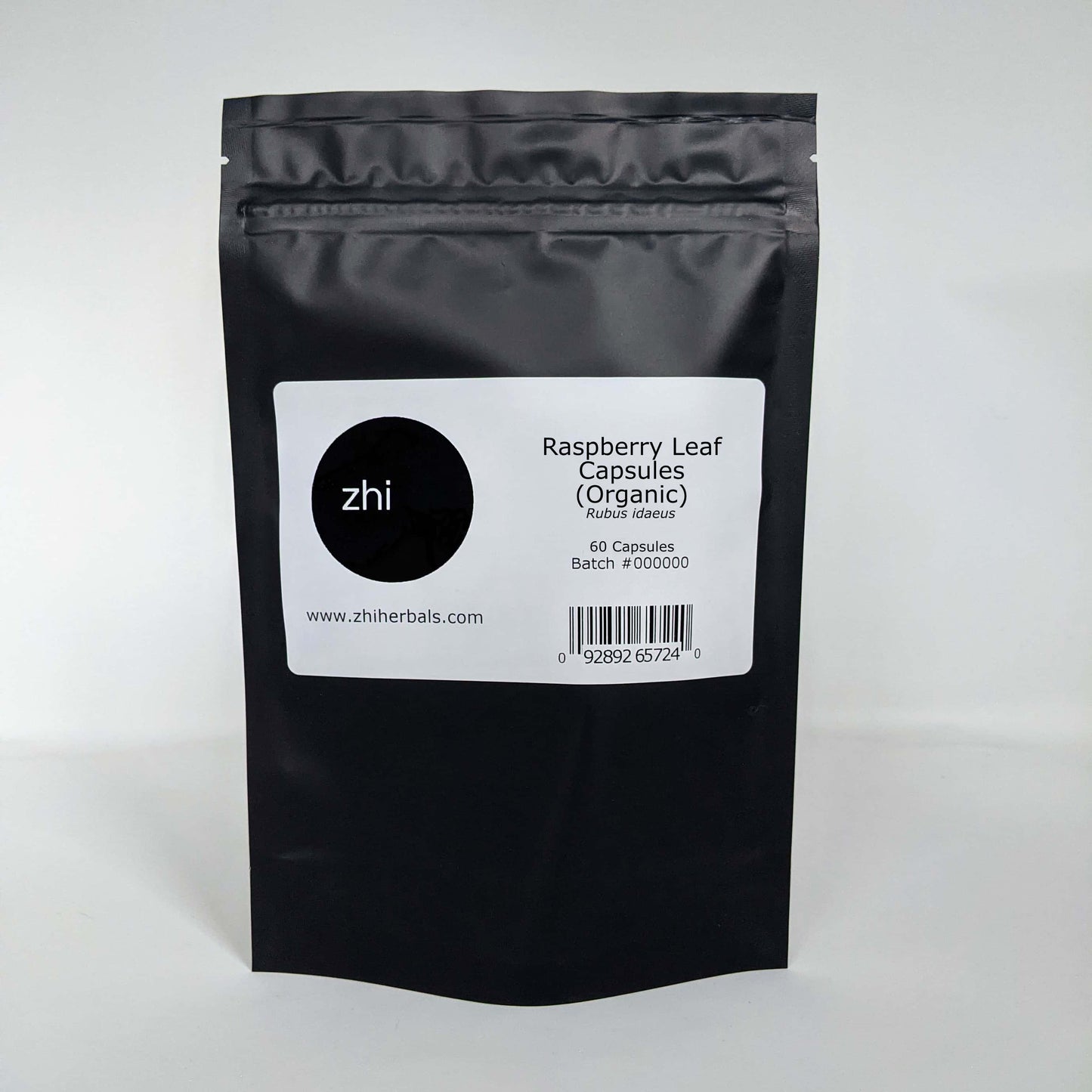 Zhi Herbals Raspberry Leaf Capsules (Organic) in a black resealable bag with product label and barcode.